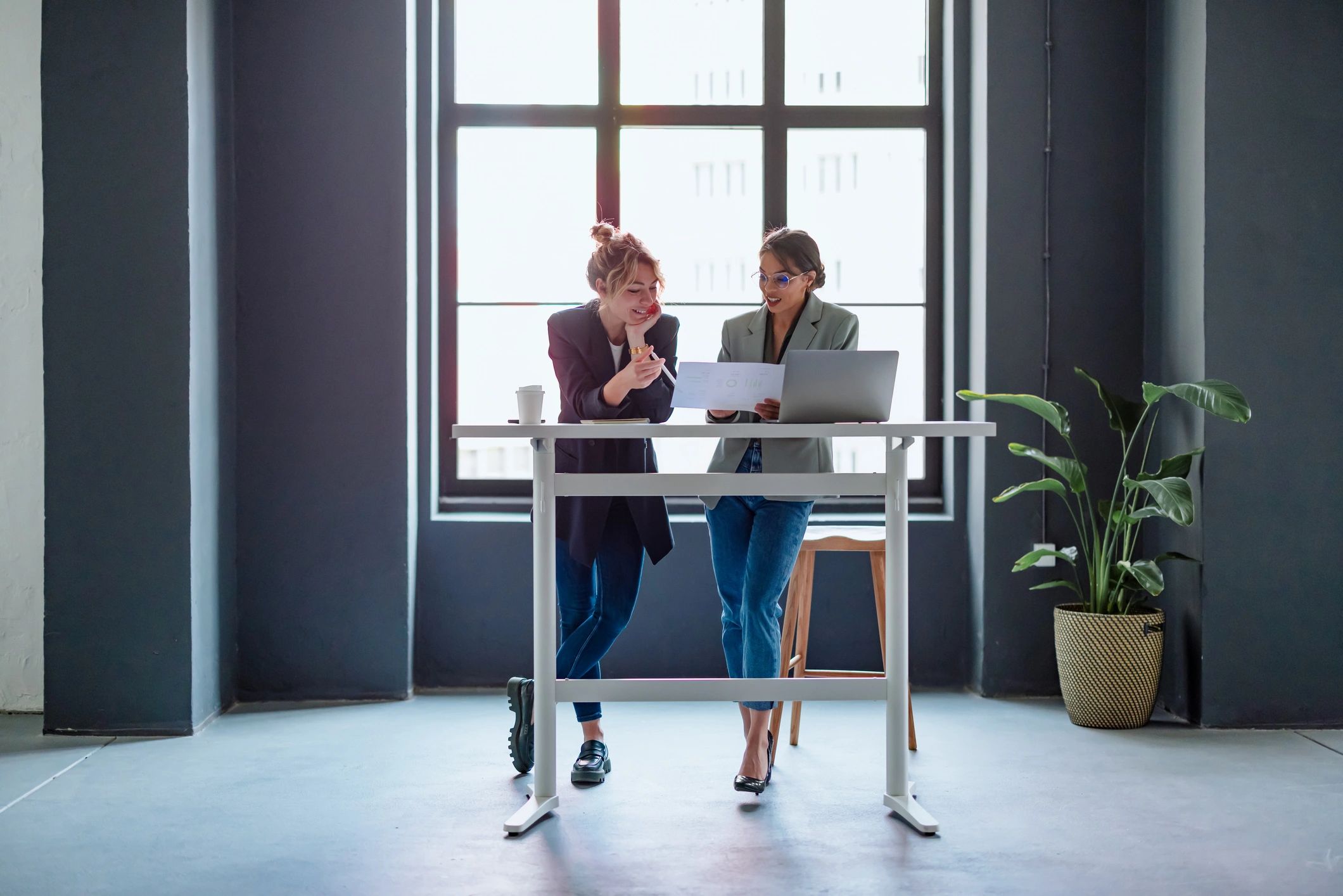Professionals reviewing documents together in a calm modern office