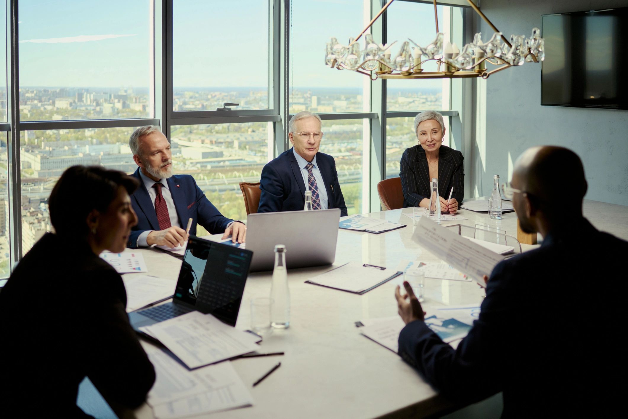 Executive team in strategic discussion in a boardroom